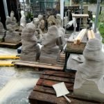 seven presawn flying buttress figurines and seven old flying buttress figurines in the workshop